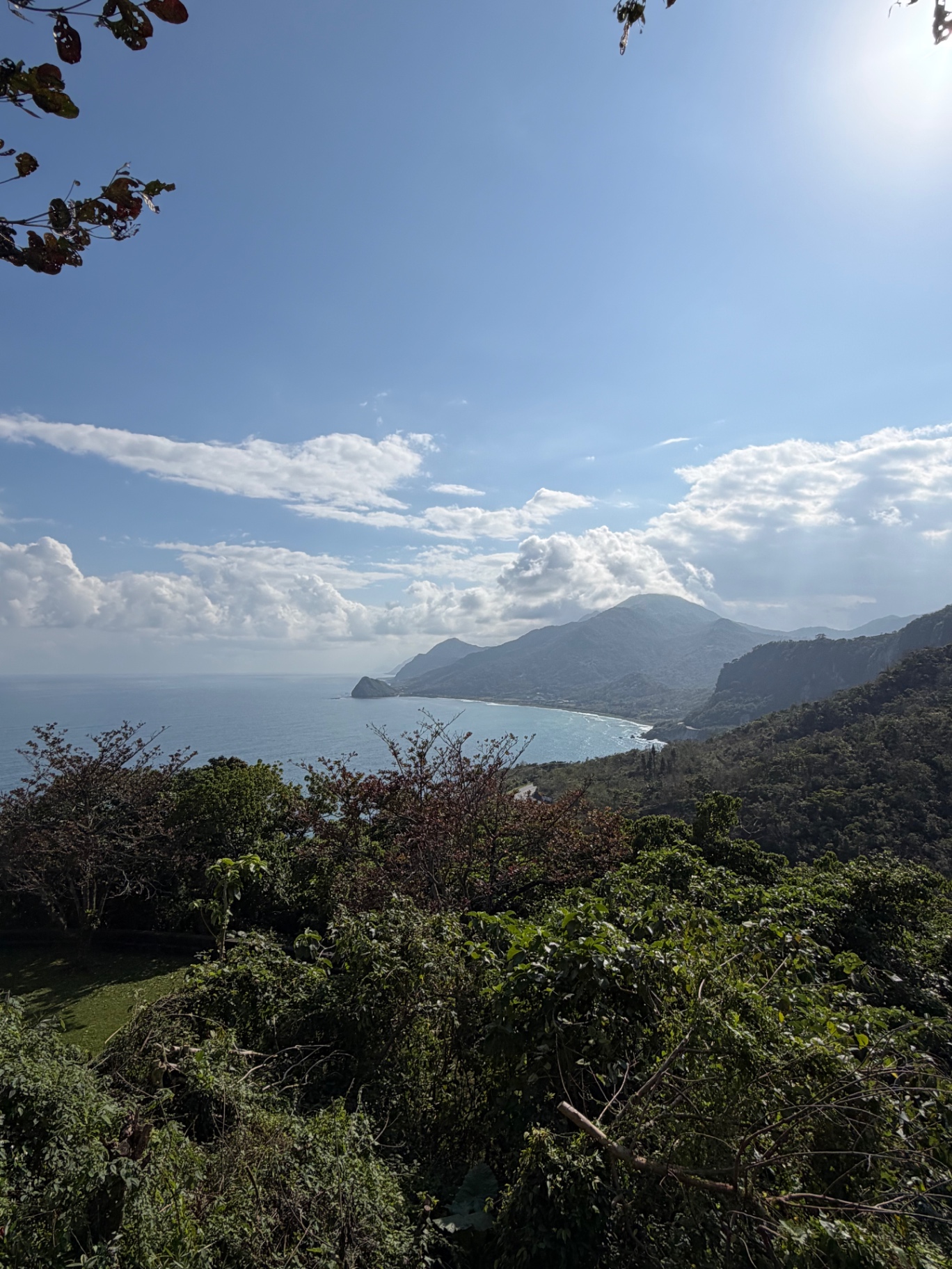 Sweeping overlook of the East Coast headlands and Pacific bay