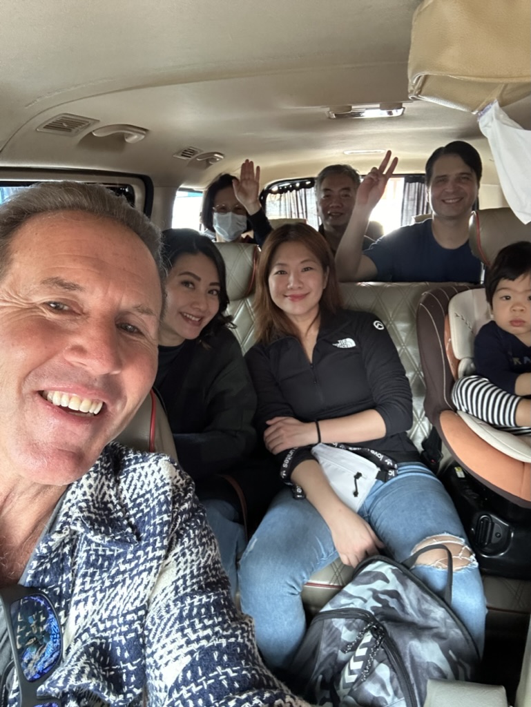 The crew piled into the van, grinning between stops