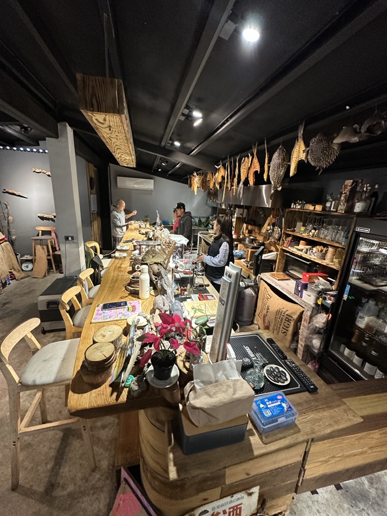 Rustic Taiwanese counter restaurant with dried fish overhead