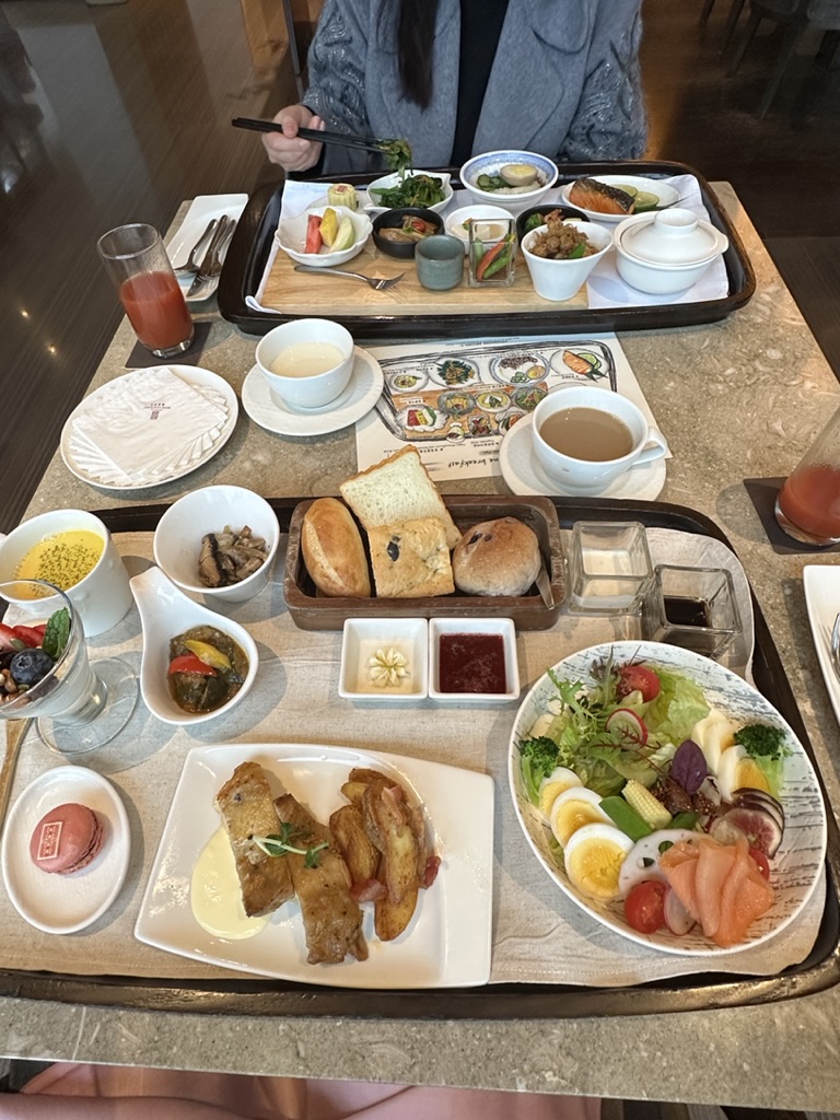 Elaborate hotel breakfast trays on marble