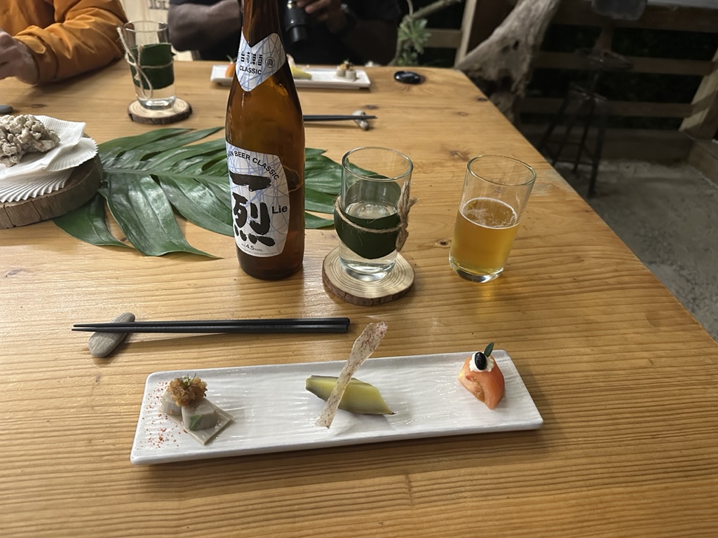 Chef's tasting plate with a bottle of local classic beer