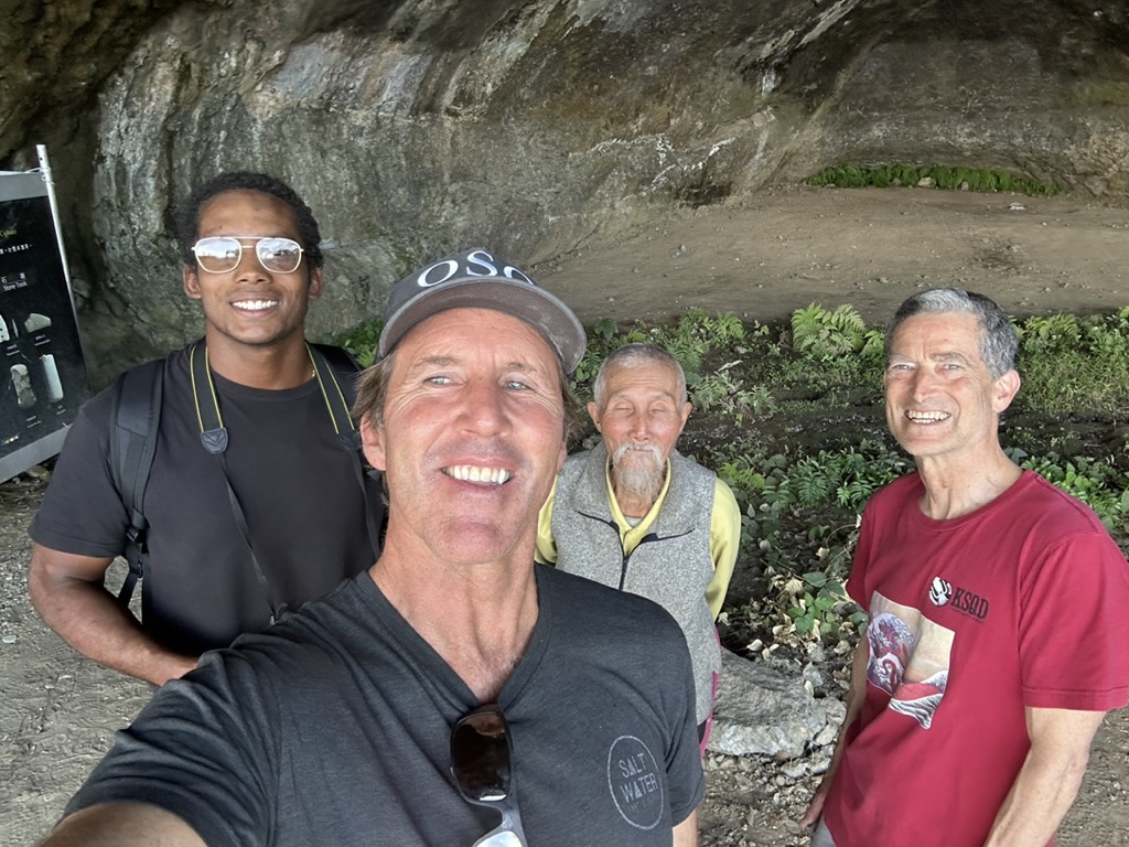 Group portrait with the elder at the cave